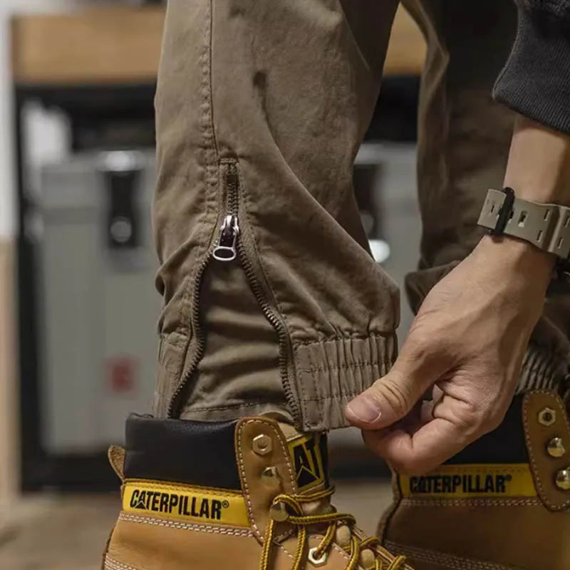 Pantalon cargo à poches zippées et élastiques chevilles