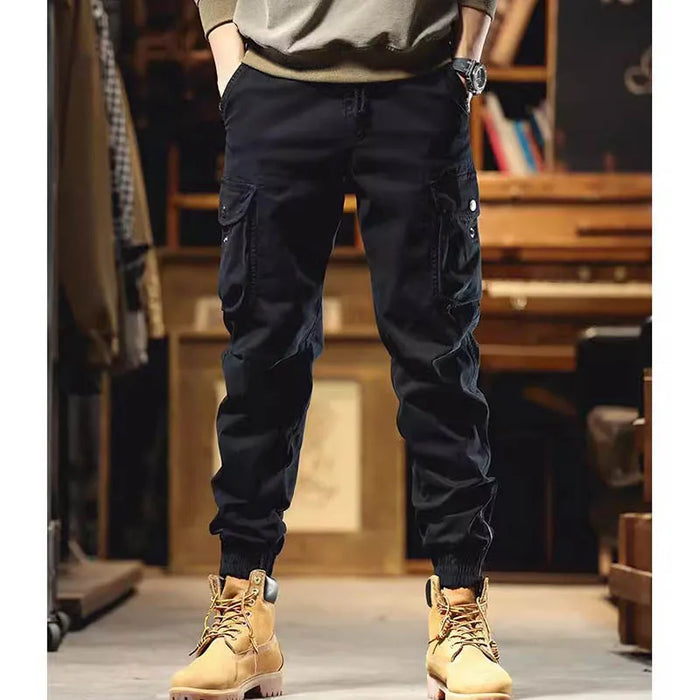 Pantalon cargo à poches zippées et élastiques chevilles