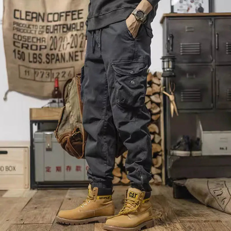 Pantalon cargo à poches zippées et élastiques chevilles