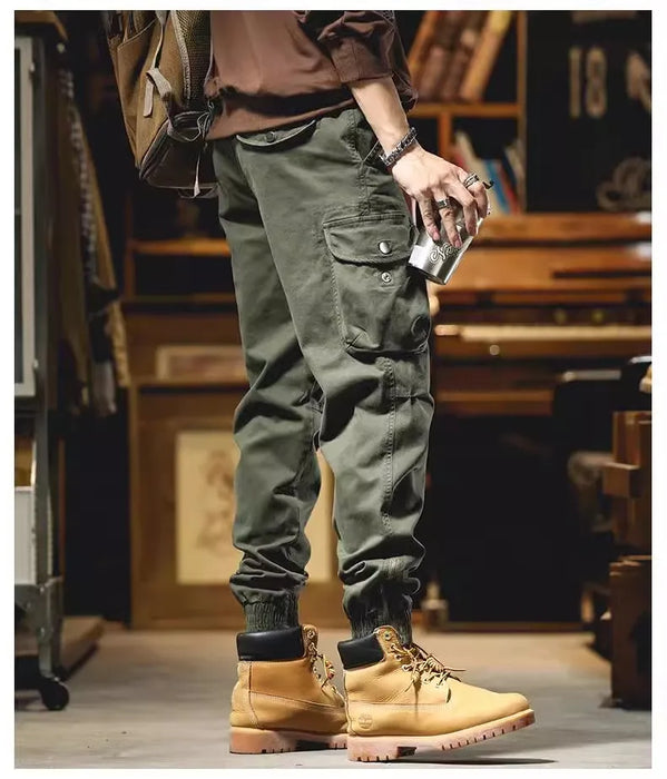 Pantalon cargo à poches zippées et élastiques chevilles